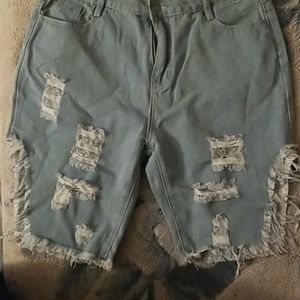 NEVER WORN!! Distressed denim shorts.